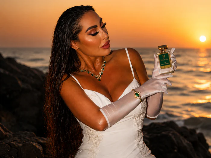 AURA by Patchouli Privé — signature bottle in lifestyle setting